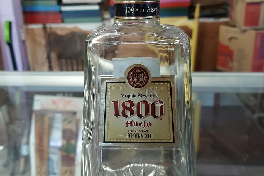 1800 ColecciΓ³n tequila bottle