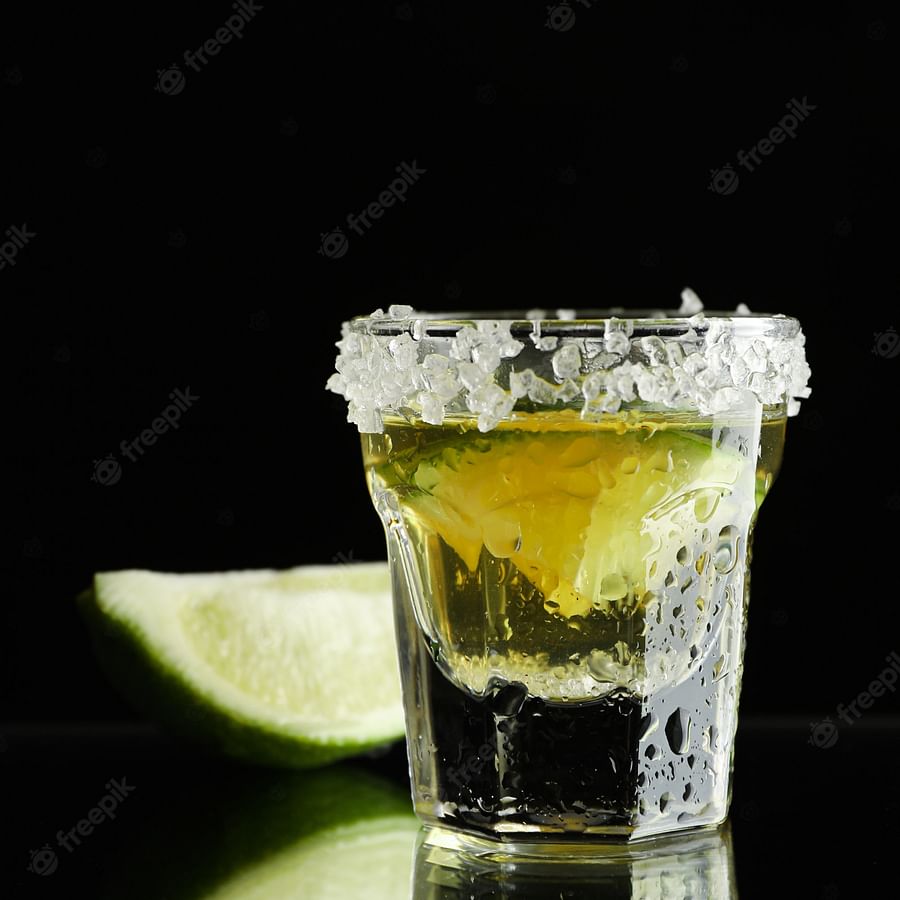Shot of tequila with a fresh lime slice